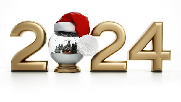 New year 2024 concept with Santa’s hat on the snowglobe.