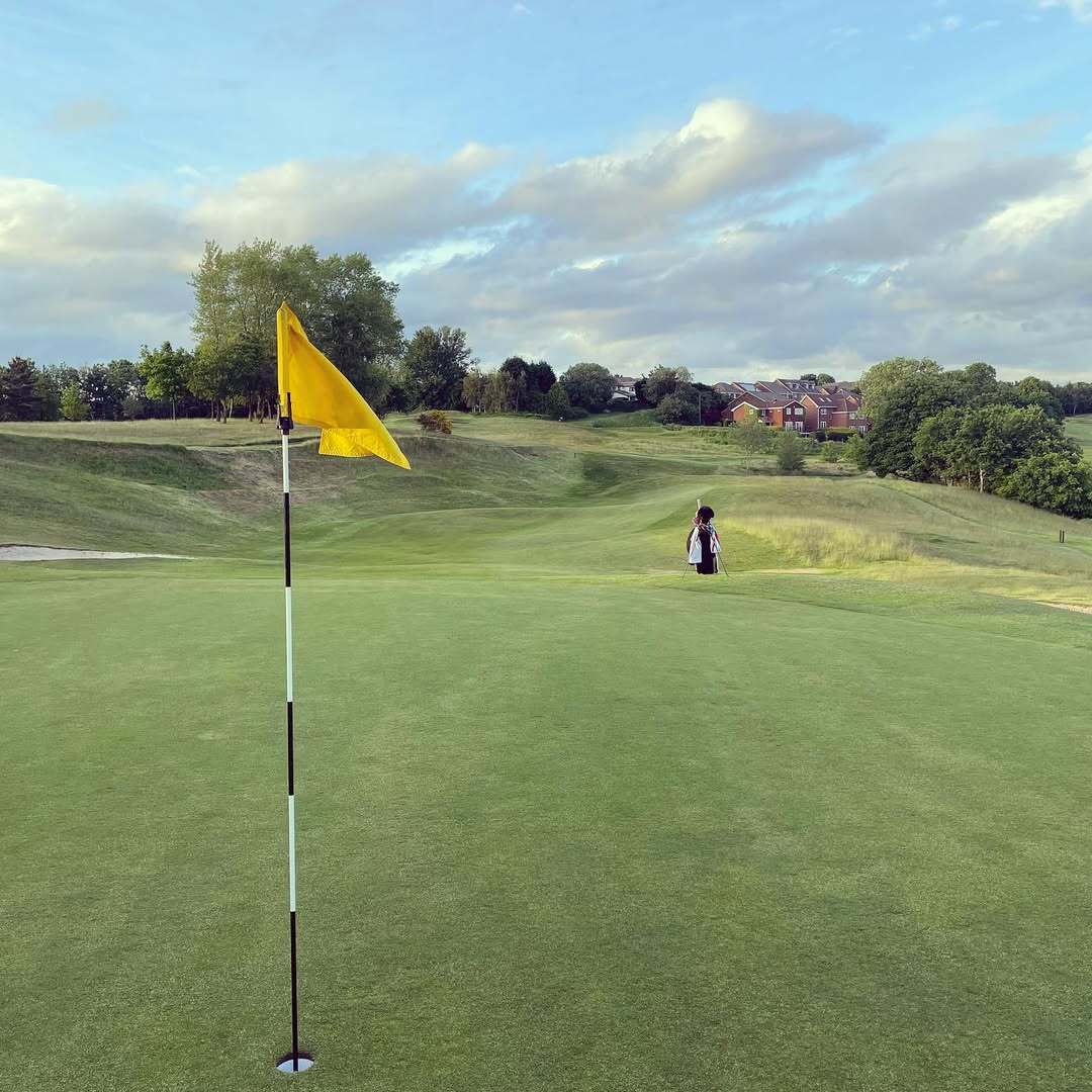 Yellow flag with bunkers guarding the green